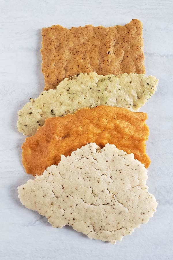 Variety of sourdough crackers on a white background