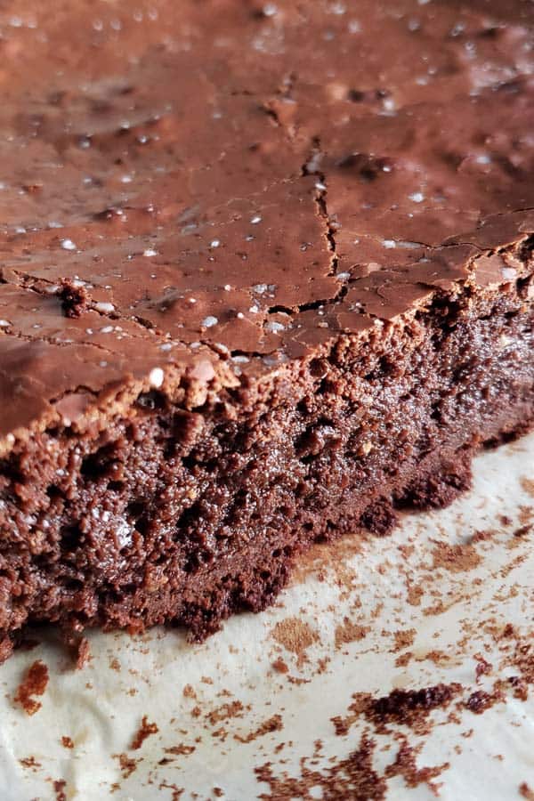 close up of a cross section of brownies with condensed milk