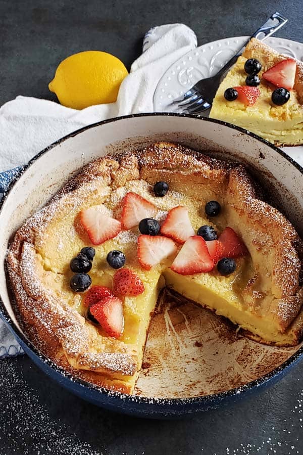Sourdough dutch baby topped with berries.