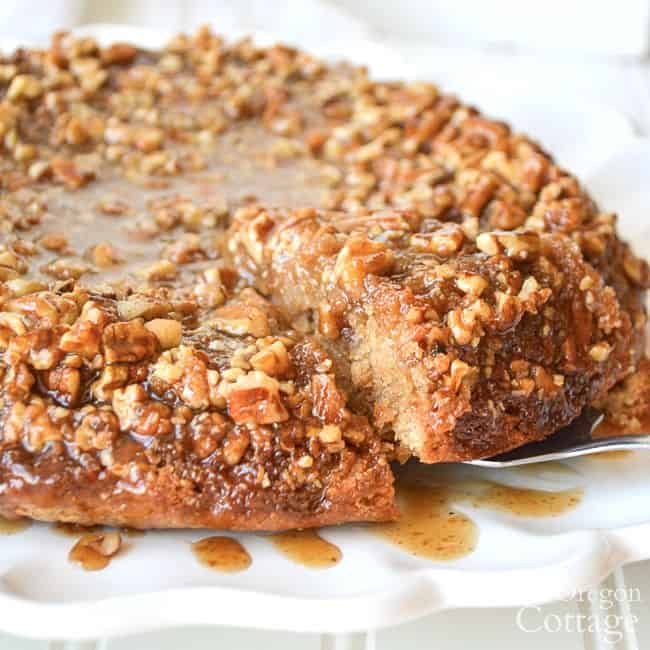 close up of sticky bun sourdough coffee cake on a white serving platter